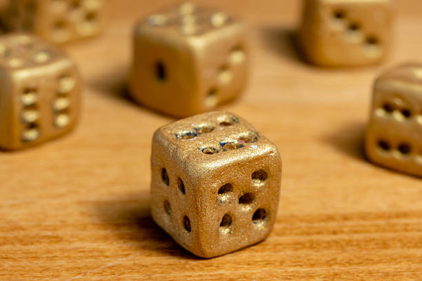 A set of six gambling dice on the table, close up.