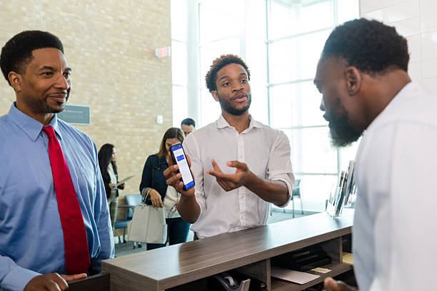 istock African American Men Discussing Mobile App in Office 2214081818