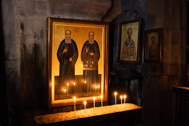 Icon Paintings and Candlelight in Monastery Church