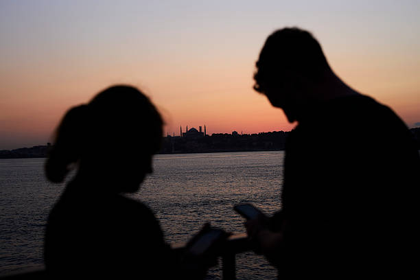 istock blurred people with sunset sky of Istanbul 2214083763