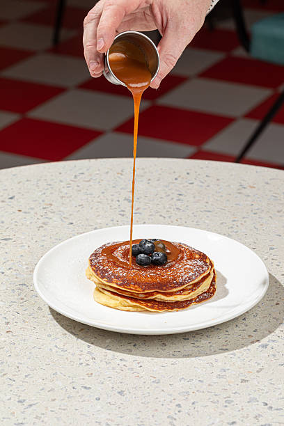istock Portion of pancakes with blueberries and sauce 2214084599