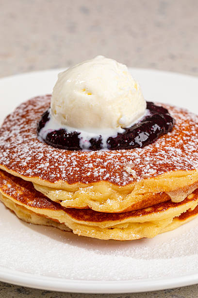 istock Portion of pancakes with blueberries and ice cream 2214085076