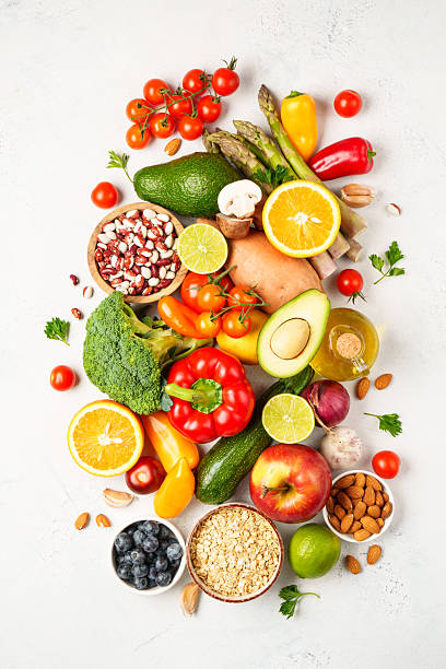 istock Food background. Fresh vegetables, leaves, grains and nuts. 2214085492