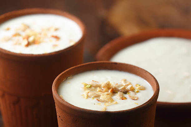 istock Lassi in Clay Cup Topped with Dry Fruits 2214087254