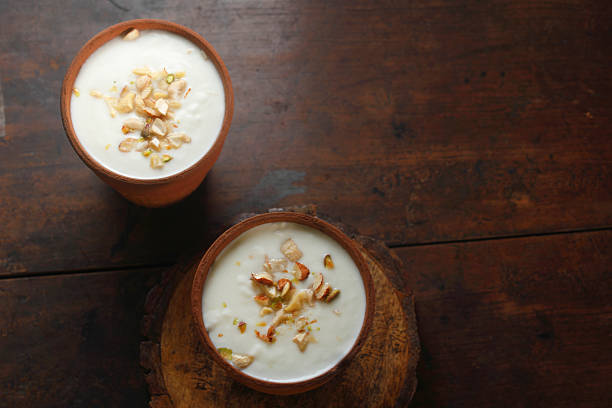 istock Lassi in Clay Cup Topped with Dry Fruits 2214087481