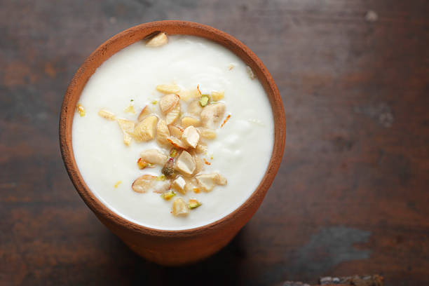 istock Lassi in Clay Cup Topped with Dry Fruits 2214087594