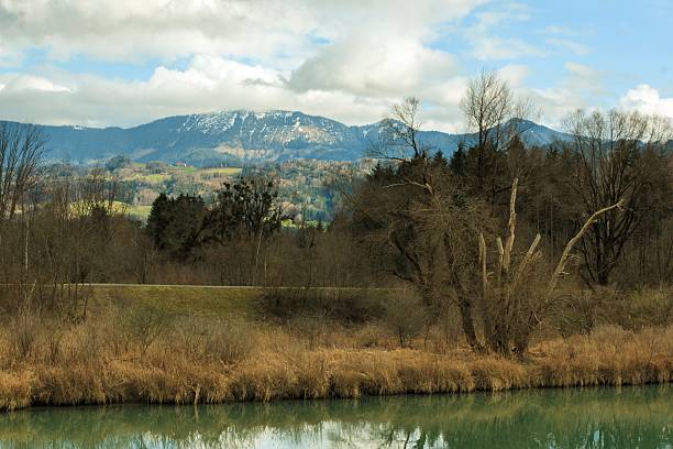 Bavaria in spring, view of the Alpine foothills and spring forest from the road bridge over the Inn River.