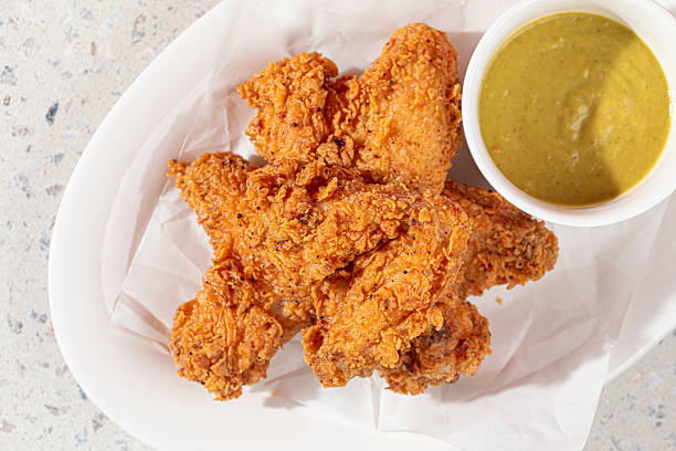 istock Golden fried chicken with sauce in the cafe 2214090044
