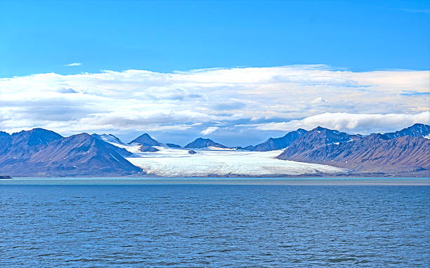 istock Massive Coastal Glacier Flowing From the Mountains 2214099955