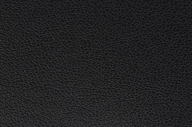 istock Close-up of textured black leather surface revealing intricate patterns and details 2214101874