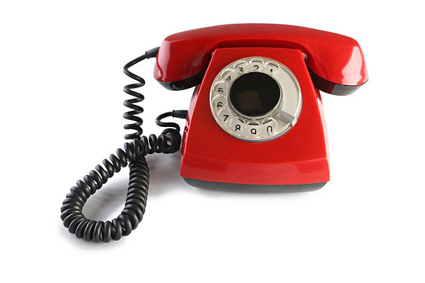 istock Red retro telephone isolated on a white 2214103777