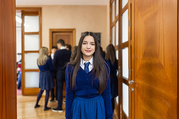 istock ```csvConfident Schoolgirl in Uniform at School Corridor 2214104277