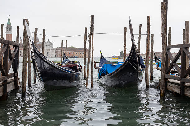 istock Moored Gondolas in Venetian Canal View 2214109775