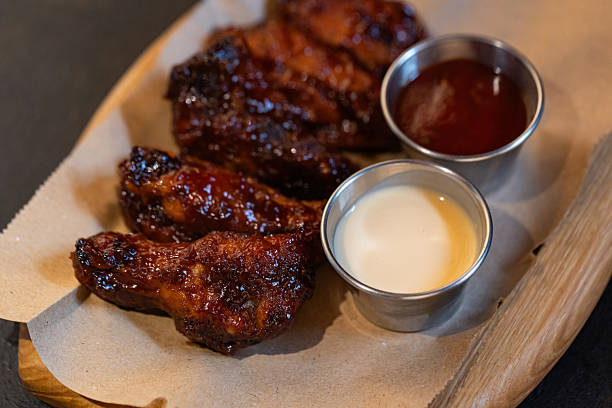 istock Closeup of chicken wings with dips served at restaurant 2214109844