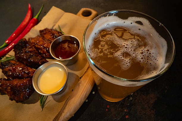 Closeup of chicken wings with dips served at restaurant for design purpose