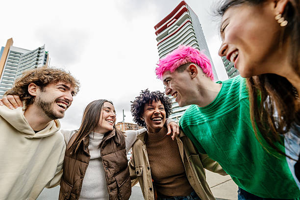 istock Multiracial young group of friends laughing outside 2214113010