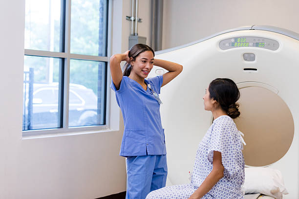 istock Doctor and Patient Talking Before CT Scan 2214115800