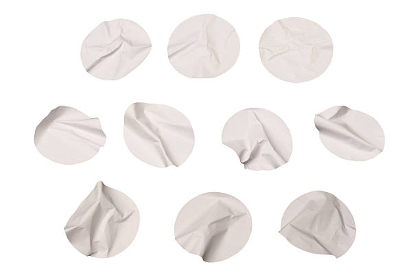 Round white stickers, blank tags labels isolated on a white background. Top view.