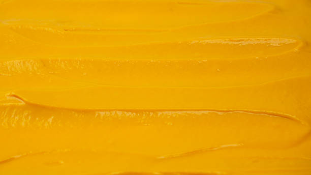 istock Yellow sauce splashes as a background. 2214118662