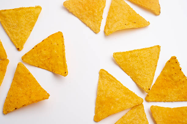 istock Crispy corn chips nachos tortilla on color background. Fast food. 2214119071