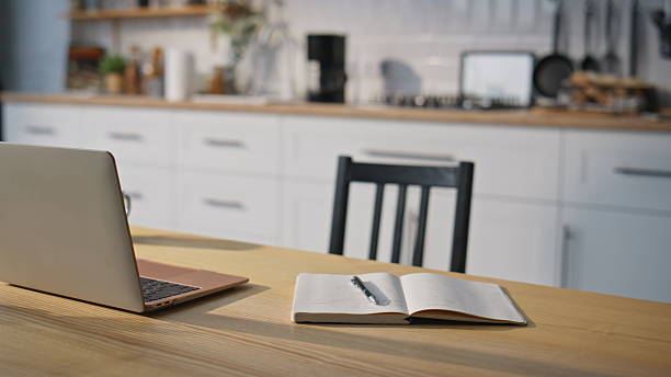 istock Organized home workspace laptop and notebook in domestic office closeup. 2214119242