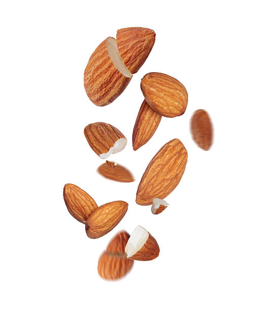 istock Almonds hanging in the air close-up on a white background 2214119909