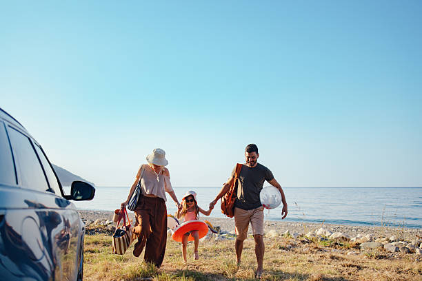 istock Family Enjoying a Beach Outing on a Warm and Sunny Day 2214123094