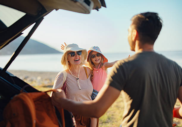 istock Family Enjoying a Sunny Beachside Getaway During a Summer Vacation 2214123164
