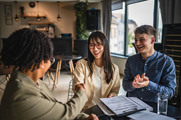 istock young japanese entrepreneur shake hands with financial adviser 2214124498