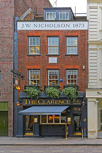 London, United Kingdom - November 21, 2013: The Clarence Restaurant at Dover Street in J.W. Nicholson Building From 1873 Winter Day.