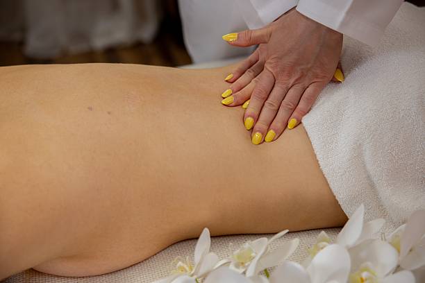 istock Relaxation Massage Therapy featuring uniquely beautiful Yellow Nails for your pampering experience 2214133825