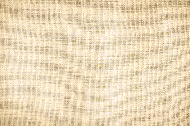 istock Brown sackcloth woven texture background in natural pattern. Jute hessian burlap, linen background in light beige cream color blank. Weaving canvas fiber line cotton cloth textured as organic. 2214137838