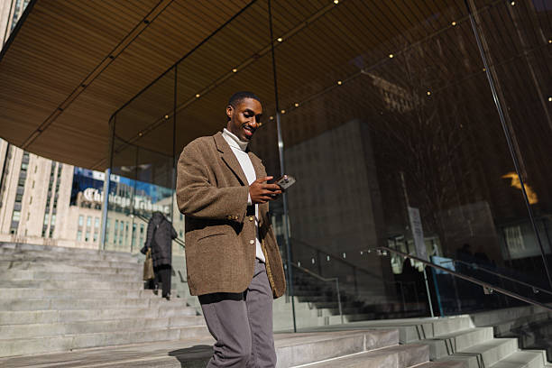 istock Young professional navigating city life, staying connected with mobile technology 2214138206