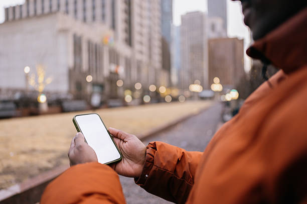 istock Tourist using smartphone with white screen in city center 2214138473