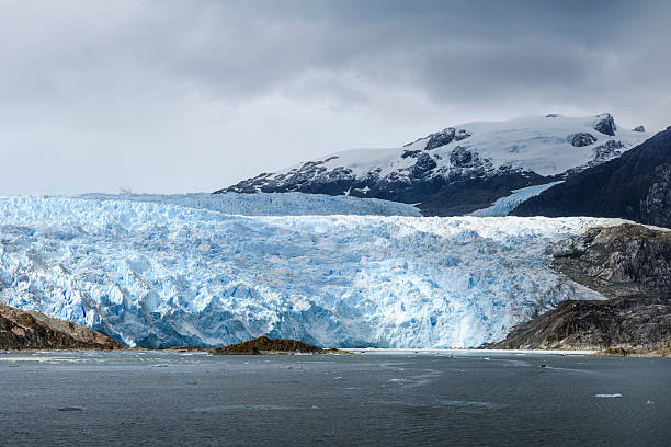 The glacier is huge (2 km. wide) and moving slowly forward as well as retreating because of global warming.
