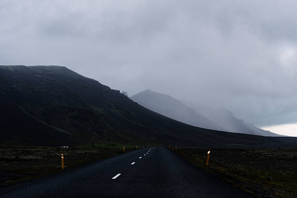 istock Vanishing Road Into Iceland’s Shadowed Mountains 2214154070