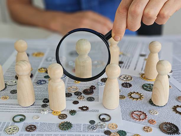 istock Investigation of teamwork dynamics using wooden figures and gears during a strategic planning session concept 2214157845