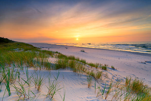 istock Beautiful summer sunset over beach at Baltic sea 2214161753