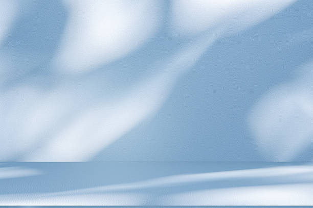 istock Studio style background wall decoration presentation uses white and blue tones. with shadows cast from a nearby window, concept creating a decorative 2214162303