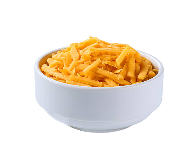 istock white ceramic bowl with shredded cheddar cheese isolated on a white background. 2214165022