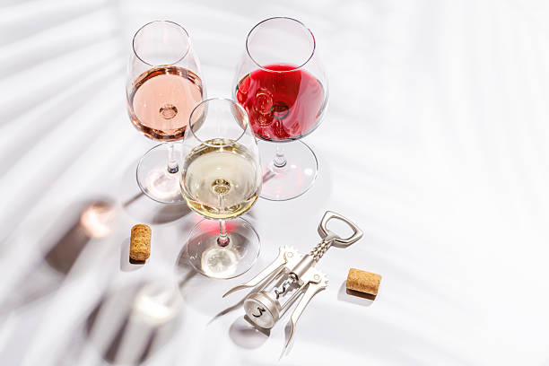 istock Three wine glasses filled with red, white, and rose wine 2214165195