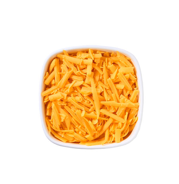 istock shredded cheddar cheese in a white ceramic bowl isolated on a white background, top view. 2214165267