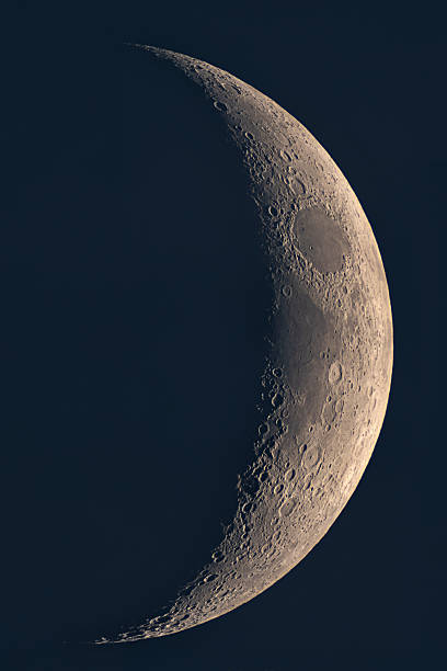 istock Panoramic view of crescent Moon terminator with detailed craters 2214170059