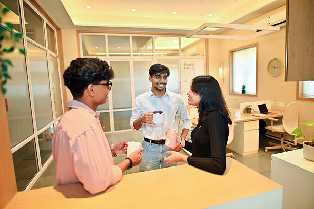 istock Young adults enjoying tea break in a modern Indian office 2214174582