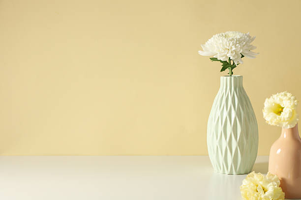 istock Fresh flowers in a vase on a light background. 2214175073