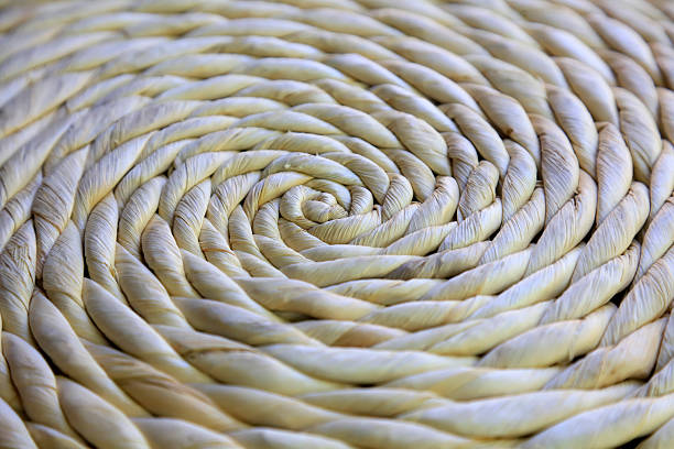 Circular weaving from natural raffia, close up.