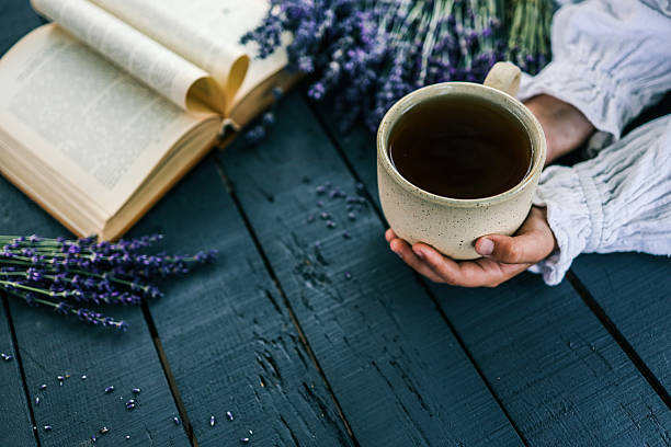 istock Hand holding a ceramic mug with 