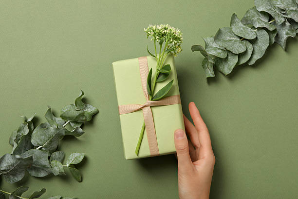 istock A gift with flowers on a green background. 2214178260