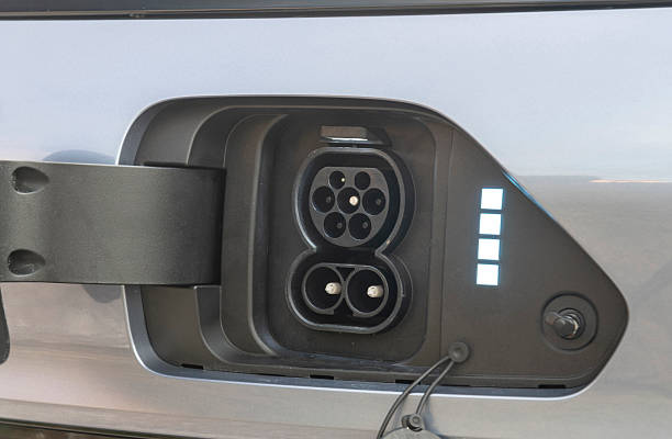 istock Charging port on a modern electric car 2214178284