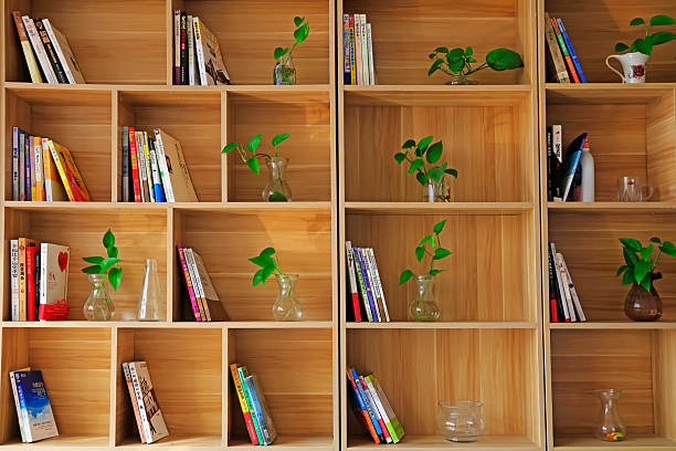 Split, Croatia - May 5, 2024: Bookshelf with books organized by rainbow colors.